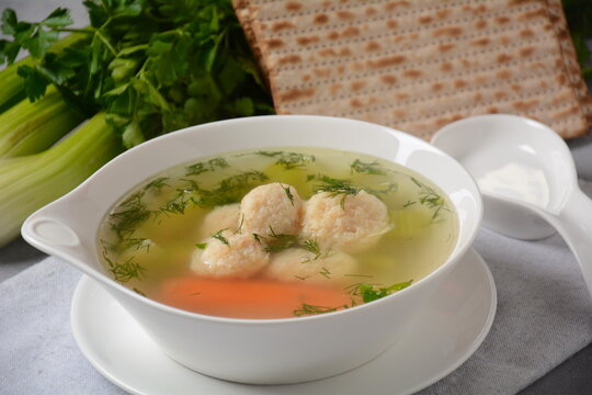 Chicken Matzo ball soup with carrots in the bowl. Jewish traditional Passover holiday food