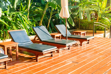 empty pool bed around swimming pool with umbrella