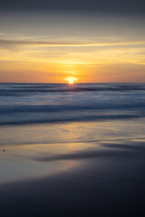 Sunset and beach. Seascape background. Bright sunlight. Sun at horizon line. Scenic view. Sunset golden hour. Sunlight reflection in water. Magnificent scenery. Copy space. Bali