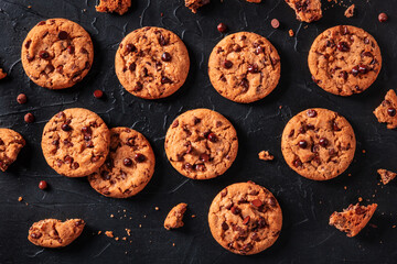 Chocolate chip cookies, overhead flat lay shot on a black background