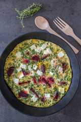 vegetable frittata with beetroot, feta cheese and herbs