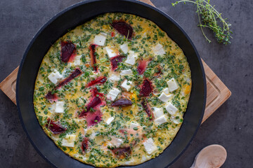 vegetable frittata with beetroot, feta cheese and herbs