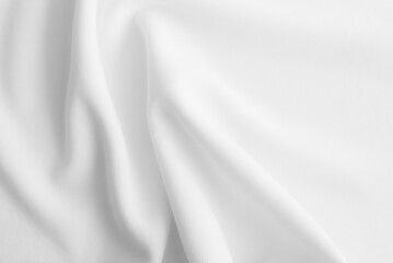 Fototapeta premium White wavy clothes background. fabric texture