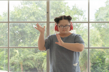 Portrait of Happy Asian young fat dancer girl dancing ballet to exercise, enjoy listening to music. Entertainment leisure fun. People lifestyle at home.