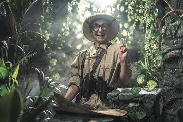 Cheerful woman exploring a tropical jungle