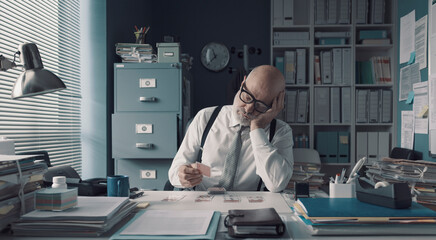 Lazy unproductive employee playing cards