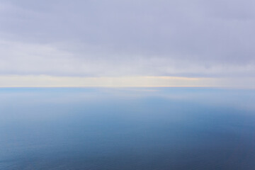 Fototapeta na wymiar foggy rainy sea to horizon, bird's eye view
