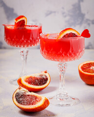 red sicilian oranges and orange juice in the glass