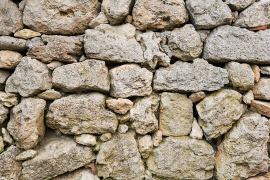 background, texture - old dry stone masonry (without mortar for binding stones)