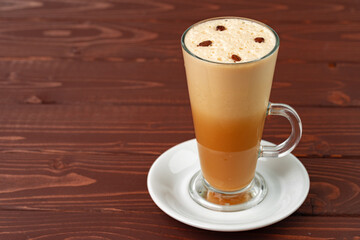 Cup of hot coffee latte on table