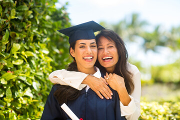 Mother hugging her daugher at her graduation