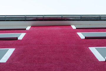 Abstract urban facade in vibrant colors with vivid and saturated intense color shows hipster cityscape and modern street design architecture with beautiful contemporary exterior in modern towns