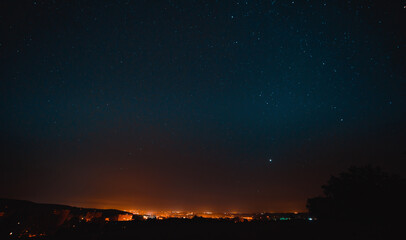 Naklejka premium The starry sky over the night city