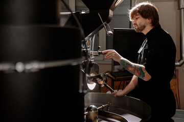 confident coffee roaster man is checking preparation process
