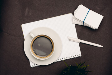 Obraz na płótnie Canvas coffee cup desktop business card pen office close-up