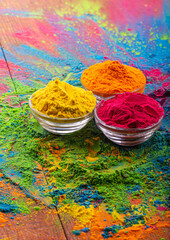 Colorful traditional holi powder in bowls. Happy holi. Concept Indian color festival called Holi....
