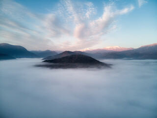 Fototapeta na wymiar Aerial view, beautiful of morning scenery sea of cloud and the fog flows on high mountains. Russia