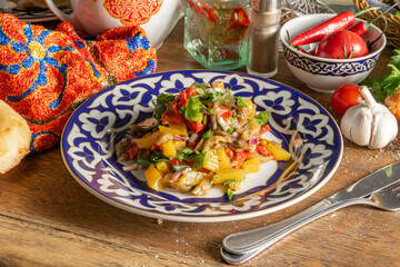 Uzbek vegetable salad of tomatoes, radish cucumbers, sweet peppers and onions