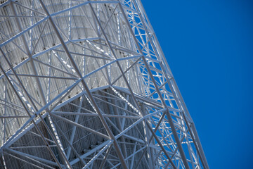 White metal construct with a blue sky