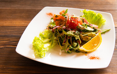 Smoked salmon salad, mixed herbs, avocado, lemon, Delicious healthy food.