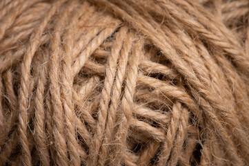Close-up view of natural twine wound on a card. Craft background