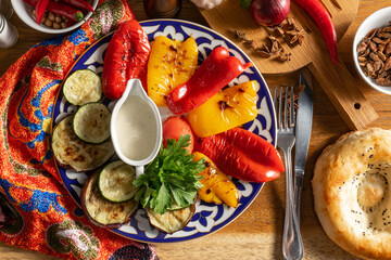 Grilled vegetables with sauce and parsley