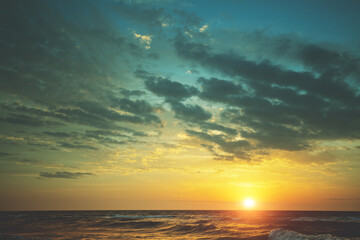 Fototapeta na wymiar Seascape in the evening. Sunset over the sea with a beautiful dramatic sky