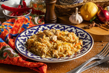 Traditional Uzbek pilaf with chicken and vegetables