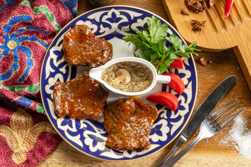 Beef medallions with tomatoes, herbs and mushroom sauce.