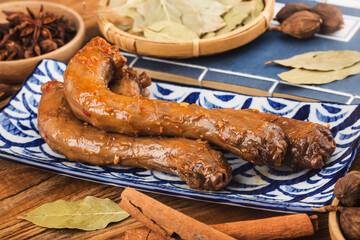 Delicious spiced duck neck on a plate