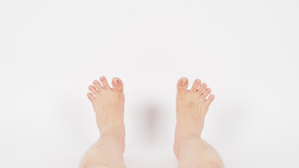 Obraz premium Asian Male barefoot and legs is isolated on white background.