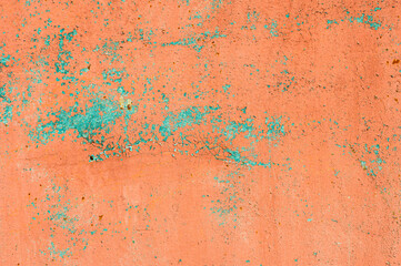 Old flaky paint on a metal surface. Red green grunge texture