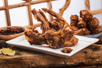 Chinese cuisine：Braised duck clavicle. Spicy duck collarbone on plate