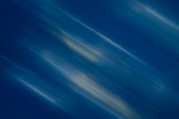 Beautiful blue-yellow texture, with blurred diagonal stripes. Backgrounds.