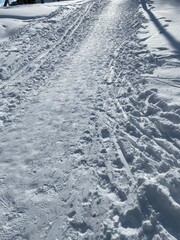 A well-trodden path through the snow.  Natural texture look for design and background. 