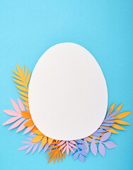 Easter greeting card. Paper blank on blue background. Flat lay, top view, copy space.