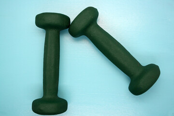 Dumbbells for exercise on a blue background.