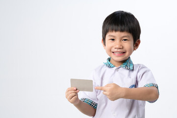 Asian boy holding paper credit card mockup for identification or bank