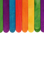 Roof made of colorful wooden boards craft material sticks for creative workshop on white background square