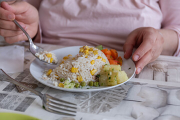 woman eating rice and vegetables, concept vegetarian food