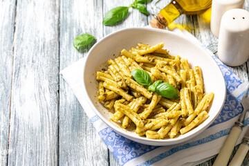vegan pasta with homemade pesto sauce of basil, pine nuts and olive oil. comfort food.