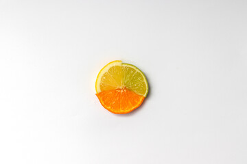 Lemon, orange and lime slices pattern on white background. Minimal trendy Summer or Spring concept.