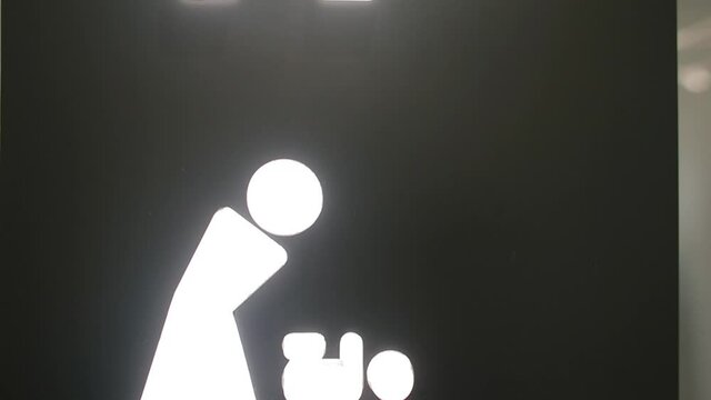 Personal care room signs. White markers grab the attention of visitors. Realisation of natural needs.