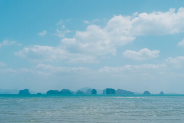 Tropical nature clean beach and white sand in summer with sun light blue sky background.