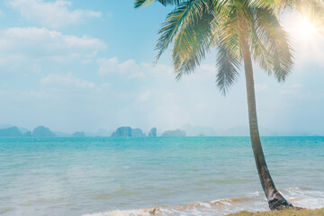 Tropical nature clean beach and white sand in summer with sun light blue sky background.