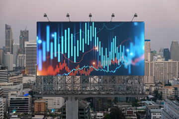 Glowing FOREX graph hologram on billboard, aerial panoramic cityscape of Bangkok at sunset. Stock and bond trading in Southeast Asia. The concept of fund management.