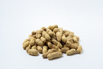 Peanuts on a white background. A small pile of peanuts. Peanuts in shell