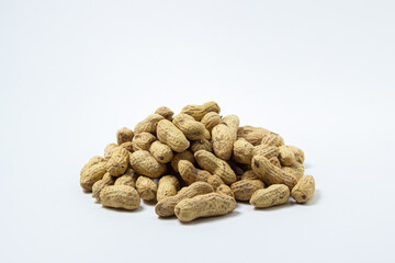 Peanuts on a white background. A small pile of peanuts. Peanuts in shell