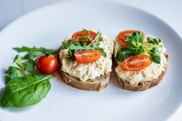 egg cheese ham dip, spread on open finger food sandwich with salad, tomato vegetables 