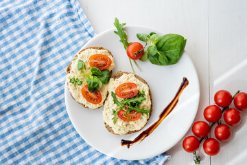 egg cheese ham dip, spread on open finger food sandwich with salad, tomato vegetables 